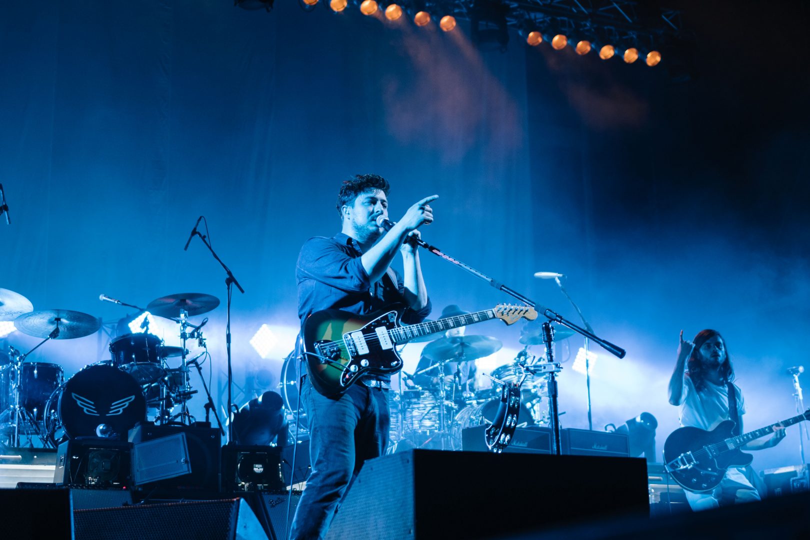 Mumford & Sons performing on tour